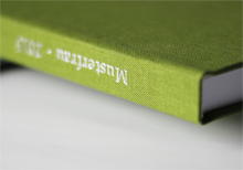 Green linen hardcover with white imprint