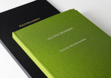 Hardcover books in linen green and black with embossed