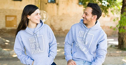 Young couple wearing matching hoodies