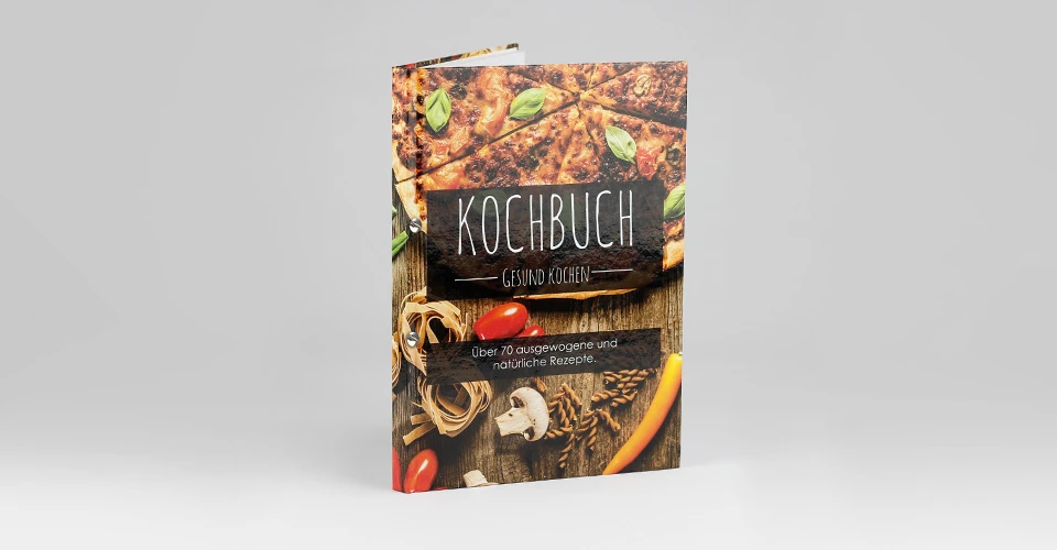 Screw post binding with print as cookbook on gray background